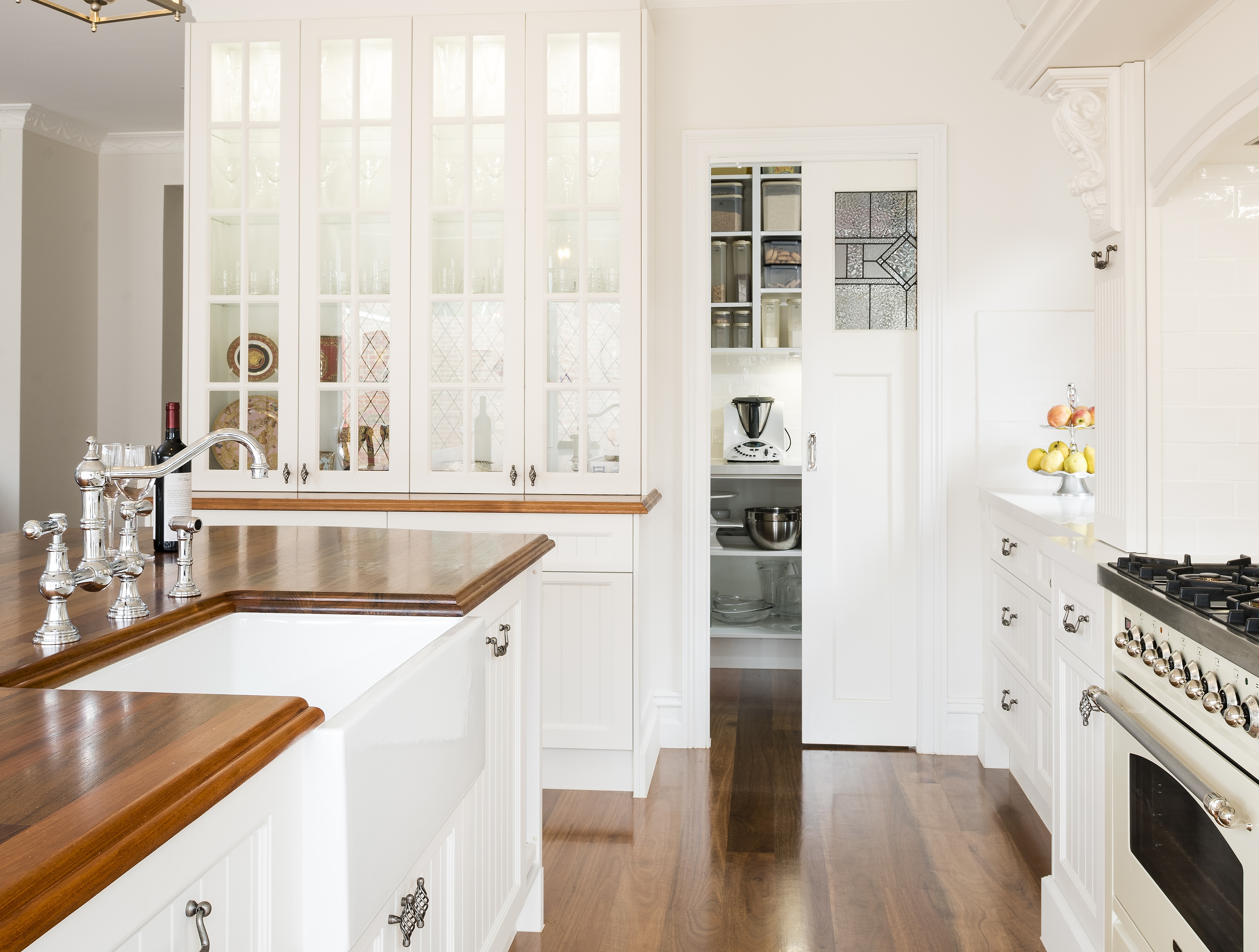 Custom butler's pantry with sink and cabinetry by Smith & Smith